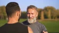 The happy father and a son talking in the park. slow motion 4k or 4k+ Resolution