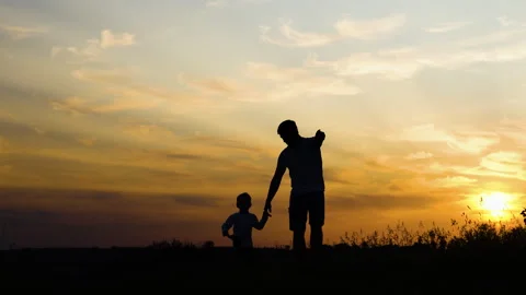 Happy father and son walking holding han... | Stock Video | Pond5