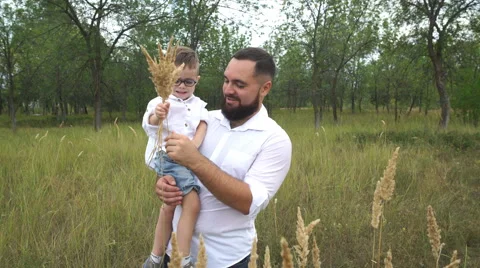 Happy father with son having fun in the field Stock Footage 68834734