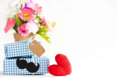 Happy fathers day concept. Stack of beautiful gift box with mustache and pape Stock Photos