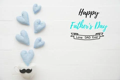 Happy fathers day concept. Top view of handmade blue heart splash out from co Stock Photos