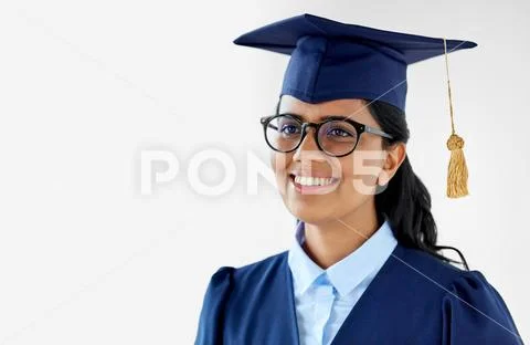 Happy female graduate student in mortarboard Stock Photos