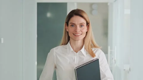Happy female human face friendly businesswoman holding folder smile close up. Stock Footage 234181532