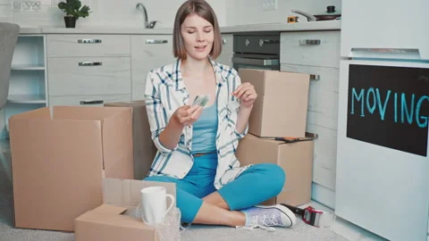 Happy female moving in new flat Stock Footage