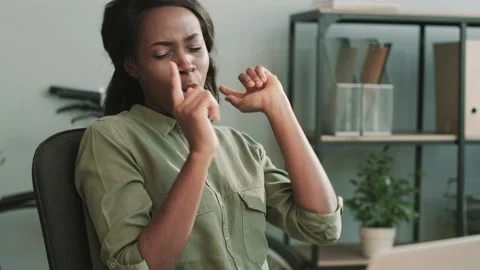 Happy female office worker dancing and singing while sitting at her desk Stock Footage 148243184