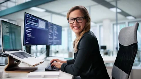 Happy Female Programmer Working On Multiple Screens Stock Footage 316444567