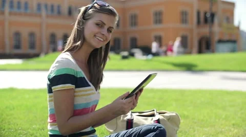 Happy female student with tablet computer in the city, steadicam shot HD Stock Footage 12133964