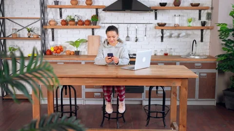 Happy female using mobile in apartment Stock Footage 157165084