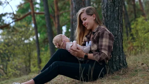 Happy first time mom speaking with her infant. Stock Footage 252331204