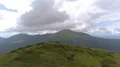 The happy four people dancing on the mountain top with a beautiful landscape 4k or 4k+ Resolution