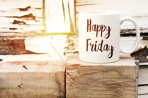Happy Friday Coffee Mug On Rustic Wood Blocks, Evoking Cozy Weekend Vibes and Wa Stock Photos