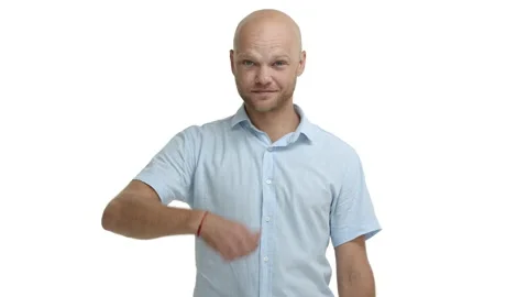Happy friendly bald guy with beard, showing thumbs-up in approval, winking and Stock Footage 141683856
