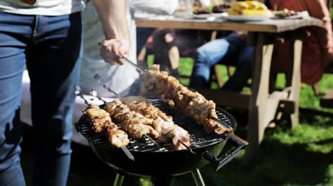 Happy friends at barbecue party in summer garden Stock Footage