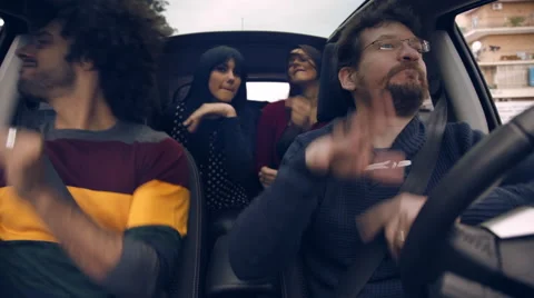 Happy friends in car having fun Stock Footage 57675450