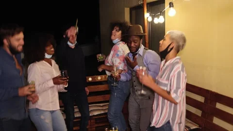 Happy friends dancing and drinking cocktails at home party outdoor Video stock 141049428