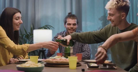 Happy friends having dinner together Stock Footage 297780661