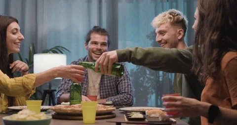 Happy friends having dinner together Stock Footage 297780726