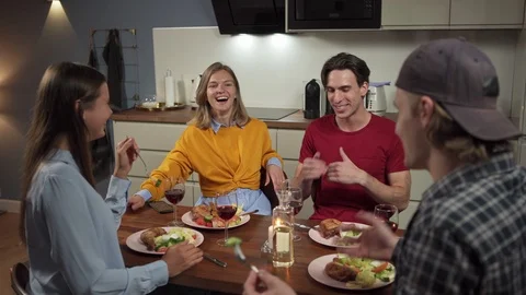 Happy friends having fun at dinner Stock Footage 114809040