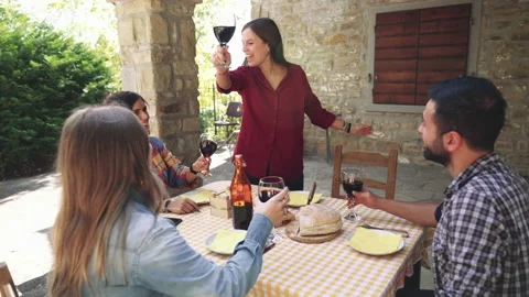 Happy friends having fun drinking red wine out side at farm house bar - Young pe Stock Footage 237455127
