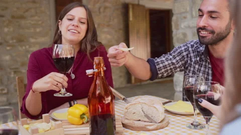 Happy friends having fun drinking red wine out side at farm house bar - Young pe Stock Footage 237465576