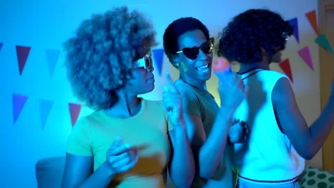 Happy friends having fun partying at home singing karaoke Stock Footage 276887113