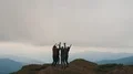 The happy friends jumping on a mountain top 4k or 4k+ Resolution