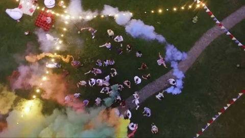 Happy friends making wedding party,throwing confetti and using colorful smoke Stock Footage