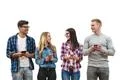 The happy friends with phones stand on the white background Photo