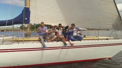 Happy friends resting on a yacht Stock Footage