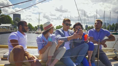 Happy friends taking selfie on a yacht Stock Footage
