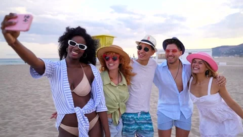 Happy friends taking selfies on beach Stock Footage 310185543