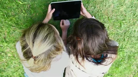 Happy friends using a tablet computer Stock Footage