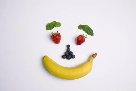 Happy fruit face closeup 写真素材
