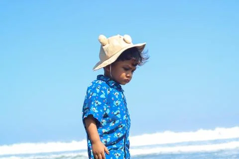 Happy fun Asian child cute little boy playing sand with toy sand tools at a.. Stock Photos
