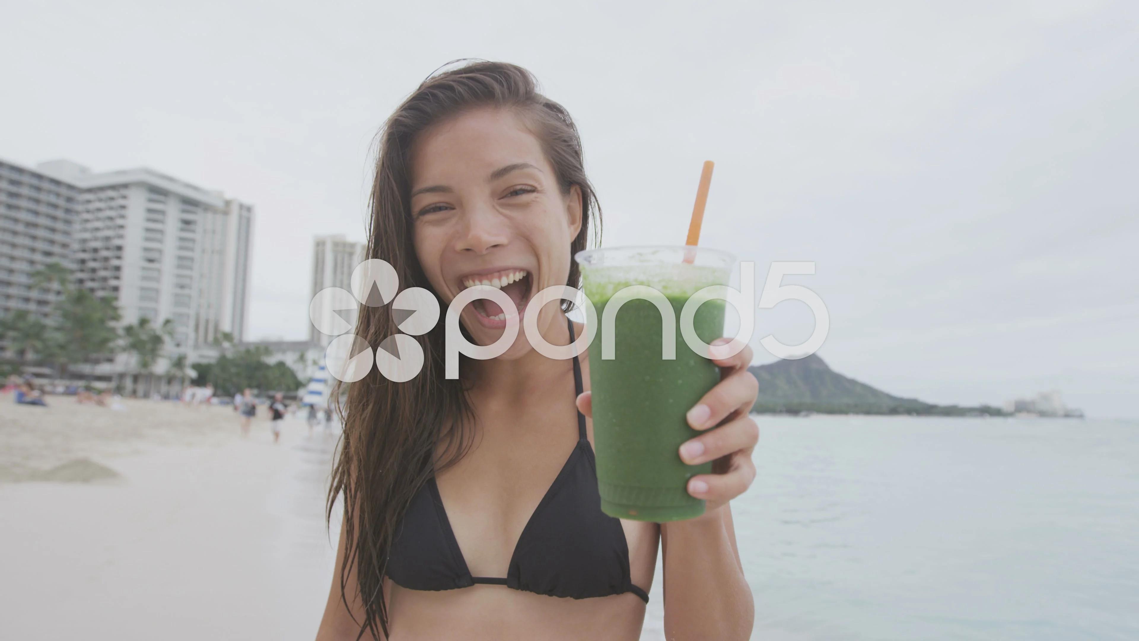 Fitness woman drinking a healthy green smoothie juice for a detox