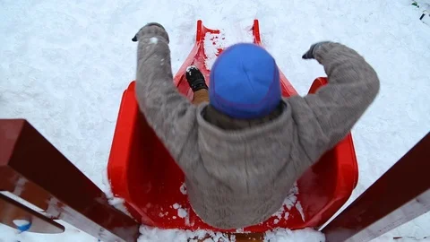 Happy funny cute kid sliding down by sli... | Stock Video | Pond5