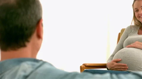 Happy future parents talking | Stock Video | Pond5
