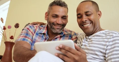 Happy Gay Couple Homosexual People Men Kissing And Using Computer Stock Footage
