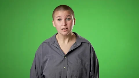 Happy gender fluid non binary young woman 20s video chatting, as seen from the Video stock 223352967