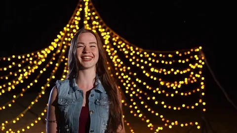 Happy girl on the background of night party illumination Stock Footage