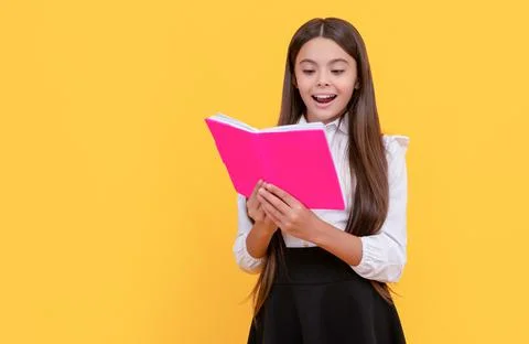 Happy girl child read school textbook yellow background, reading Stock Photos