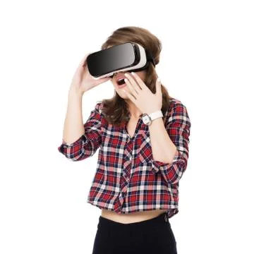 Happy girl getting experience using VR headset glasses of virtual reality, much Foto stock
