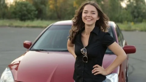 Happy girl with key in hand from new car Stock Footage