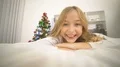 The happy girl lay on the bed and smile near the christmas tree 4k or 4k+ Resolution