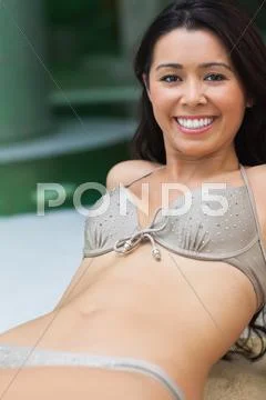 Happy girl by the pool Stock-Fotos