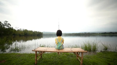 Happy girl pulling rod while fishing against landscape of lake. Stock Footage 96586066