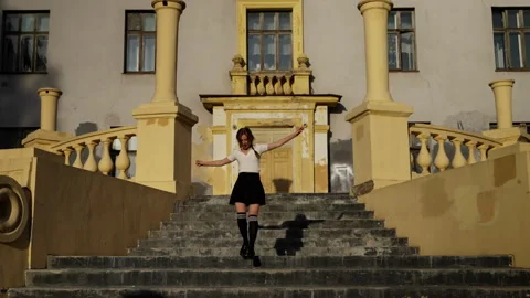 Young girl with lacy underwear walks barefoot over bridge Stock