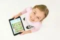 The happy girl stand with a tablet. View from above Photo