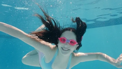 happy girl swimming underwater in pool s... | Stock Video | Pond5