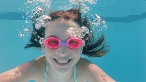 happy girl swimming underwater in pool s... | Stock Video | Pond5